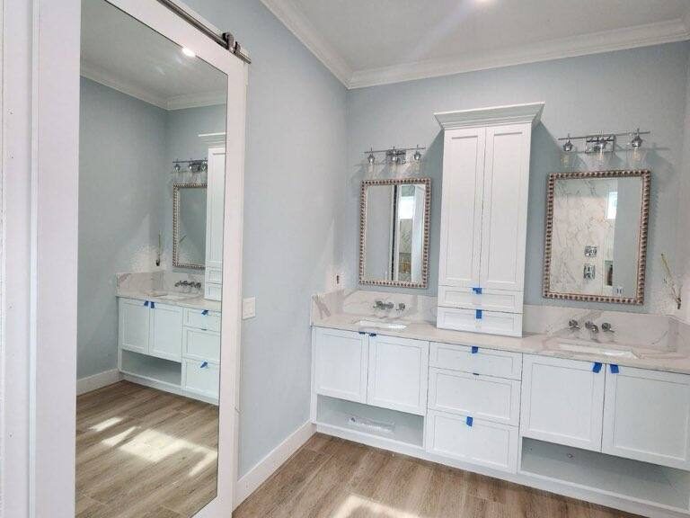 Frameless Mirror Barn Door in Contemporary Florida Home. Custom-Ordered Mirror Frames for vanities; Installed in Sarasota County Home